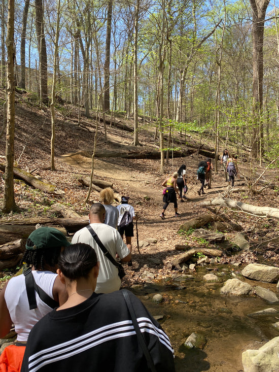 A group of people using outdoor trails to relieve stress. 